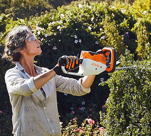 Side view of Stihl HSA 56 Cordless Hedge Trimmer with Battery and Charger