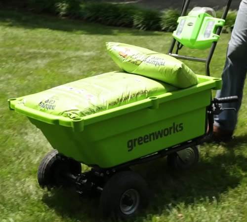 Side view of Greenworks 40v Self-Propelled Cart with 2 x batteries and charger