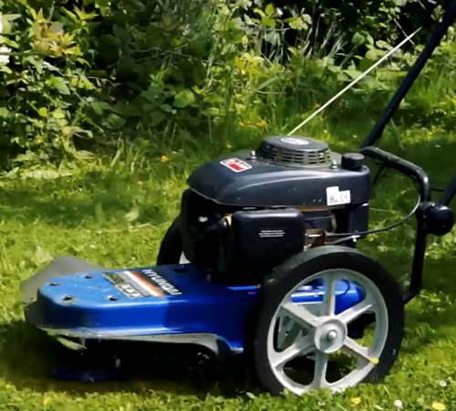 Side view of Hyundai HYFT56 Rough Cut Field and Brush Trimmer