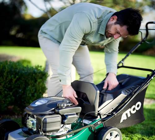 Side view of ATCO Classic Self-Propelled 16S Four Wheel Petrol Lawnmower